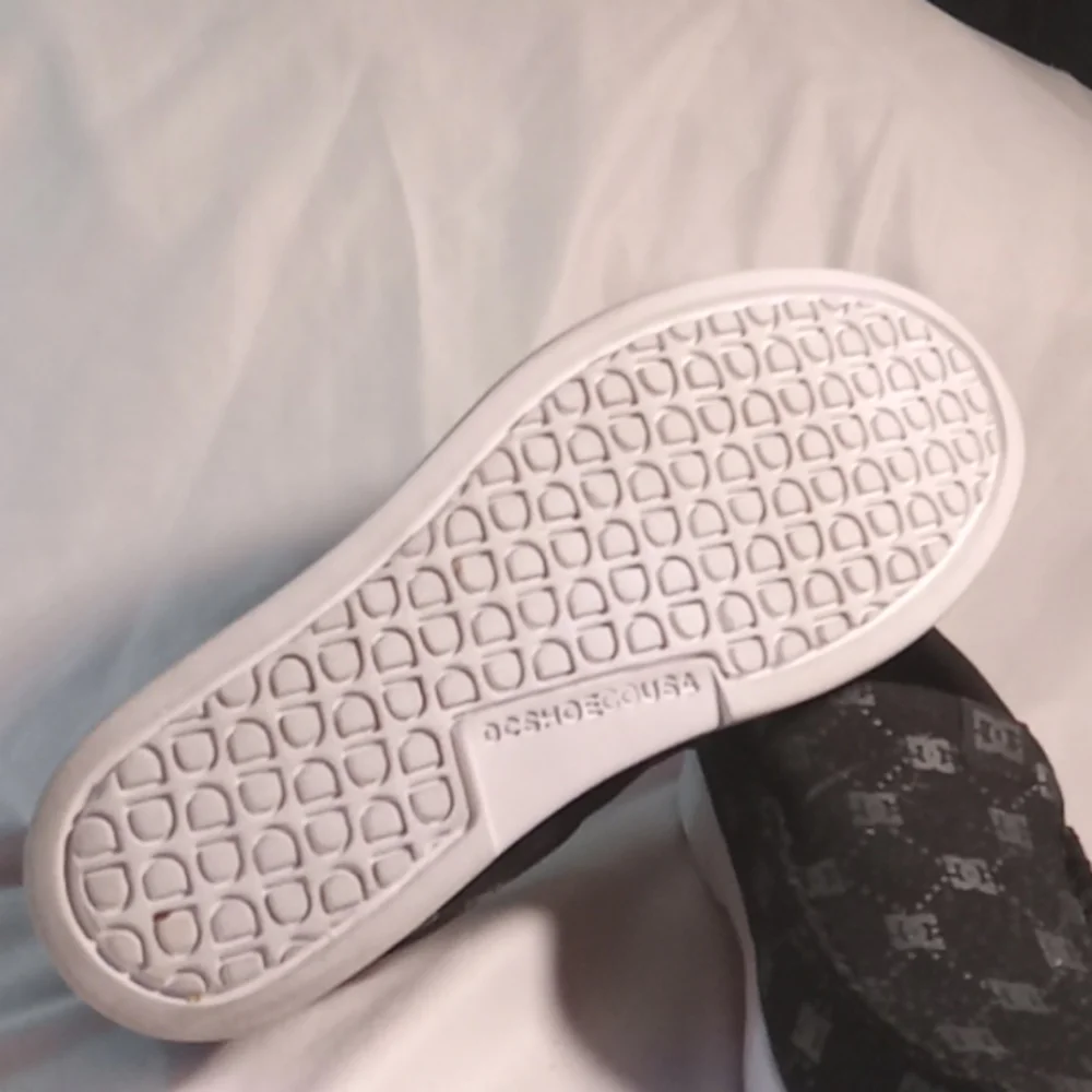 DC SHOES canvas slip on all over logo skate shoes